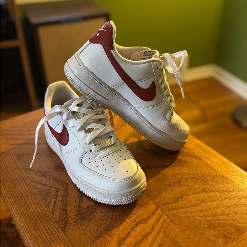 Women’s White and Orange Nike Air Force 1 Sneakers